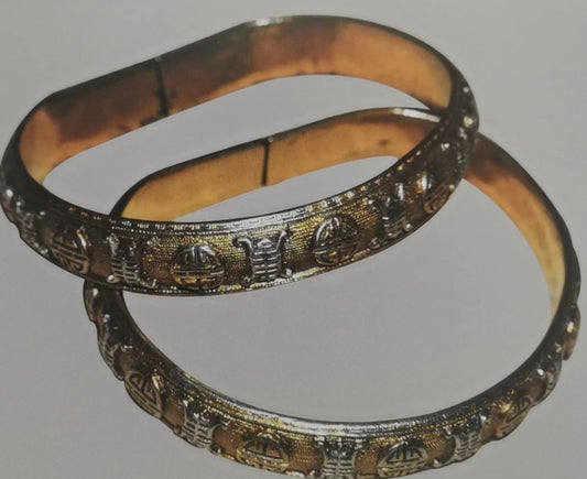 A Pair of Silver Gilt Bracelets with "Fu, Lu, Shou" Characters